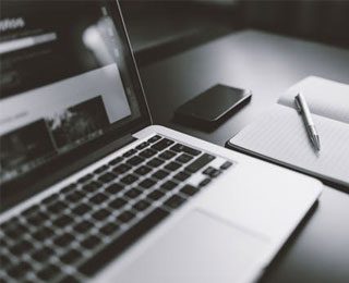 Laptop, Smartphone, Notebook and Pen
